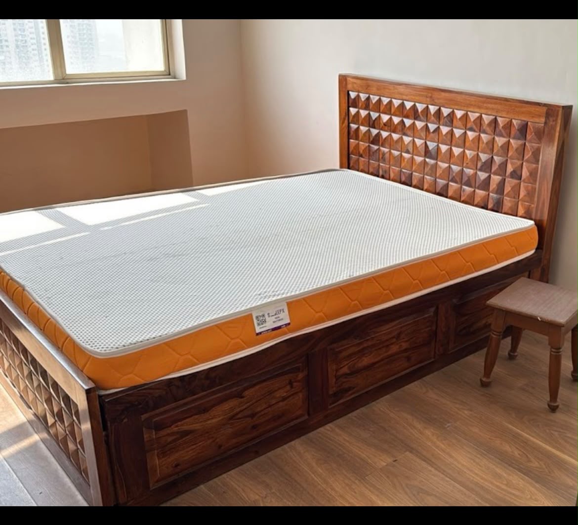 Double bed with diamond-carved headboard