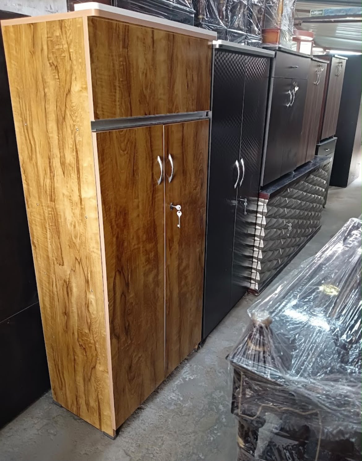 Rows of wardrobes and cabinets in stock at the shop